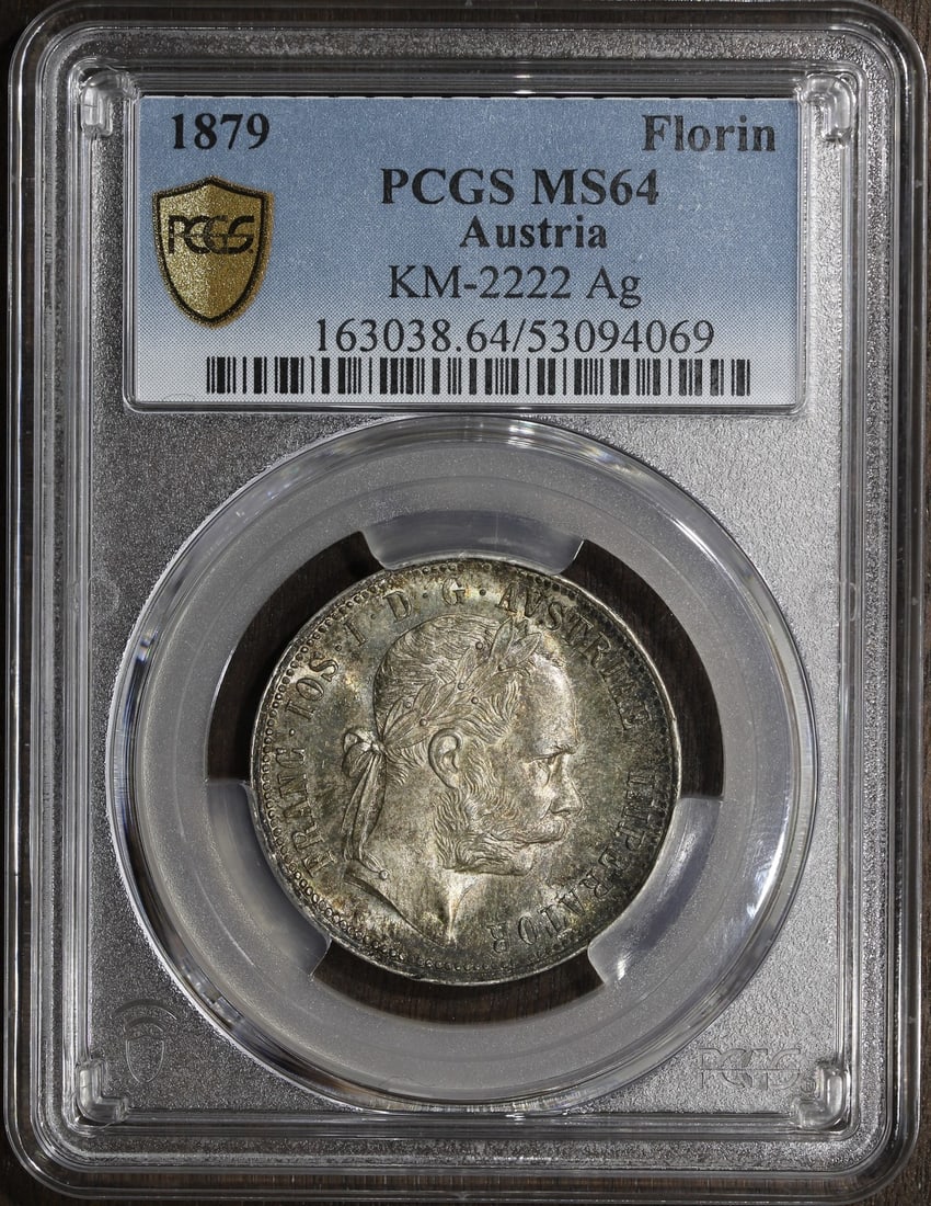 Austria 1879 Silver Florin PCGS MS64: Austria 1879 Silver Florin PCGS MS64 This 1879 Austria Franz Joseph Silver Florin is graded MS64 by PCGS, showcasing lovely luster. Composed of 90% silver, this uncirculated coin is a fine collectible