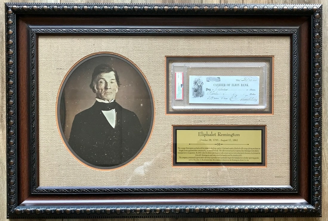 Eliphalet Remington Signed Bank Check Custom Framed PSA 9 Display: Eliphalet Remington Signed Bank Check Custom Framed PSA 9 Display This impressive custom framed display features a signed personal bank check by Eliphalet Remington, the renowned firearms pioneer who 