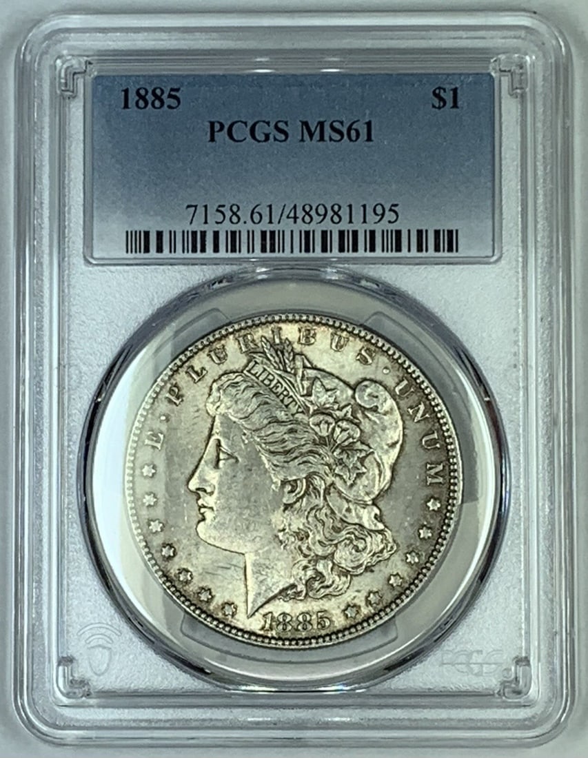 PCGS MS61 1885 Morgan Silver Dollar Lightly Toned Certified Coin: PCGS MS61 1885 Morgan Silver Dollar Lightly Toned Certified Coin This 1885 Morgan Silver Dollar features a lightly toned finish and is certified by PCGS with a grade of MS 61. The coin is uncirculated