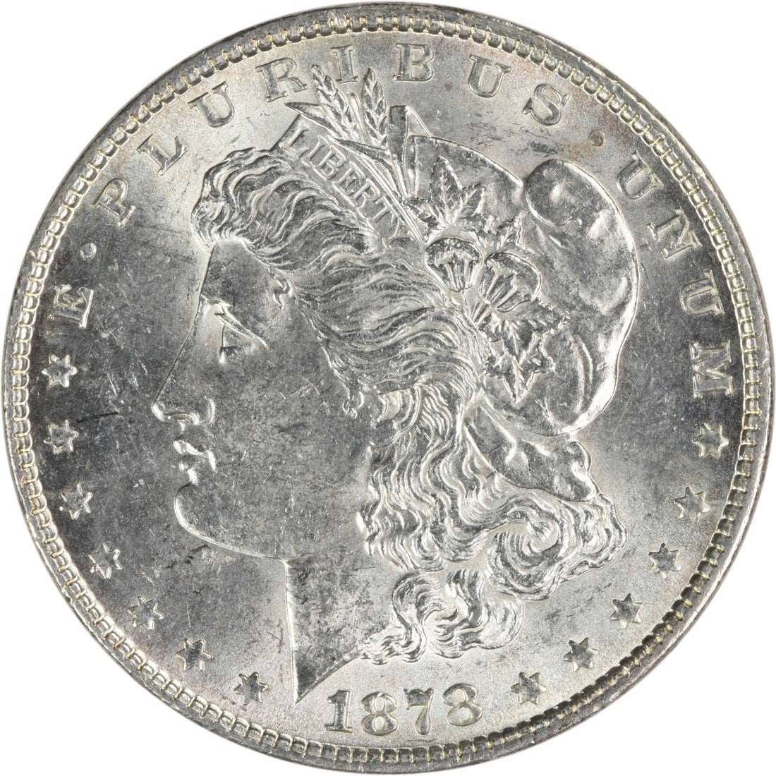 1878 Morgan Dollar Silver Coin Reverse of 1879 BU Uncirculated Uncertified: 1878 Morgan Dollar Silver Coin Reverse of 1879 BU Uncirculated Uncertified This is an uncirculated 1878 Morgan Silver Dollar featuring the 7 Tail Feathers reverse of 1879. The coin is composed of silv
