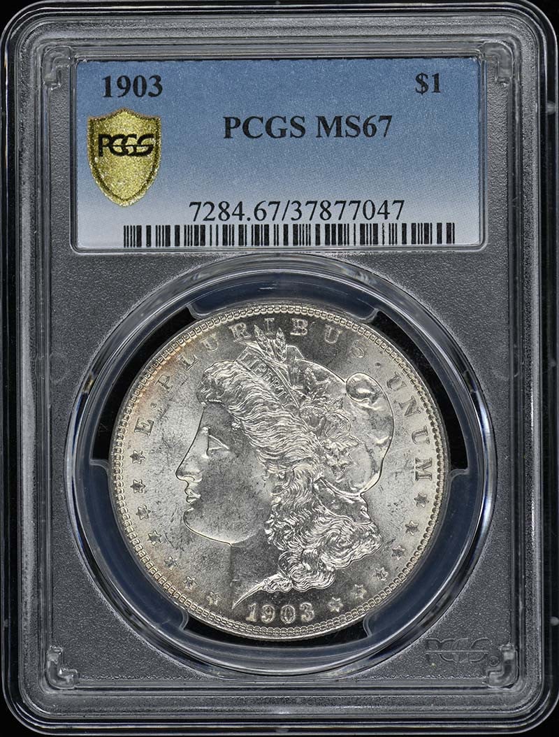 1903 Morgan Dollar PCGS MS67 Uncirculated Philadelphia Mint: 1903 Morgan Dollar PCGS MS67 Uncirculated Philadelphia Mint This stunning 1903 Morgan Dollar, certified by PCGS with a grade of MS67, represents an exceptional example of American coinage. With a stri