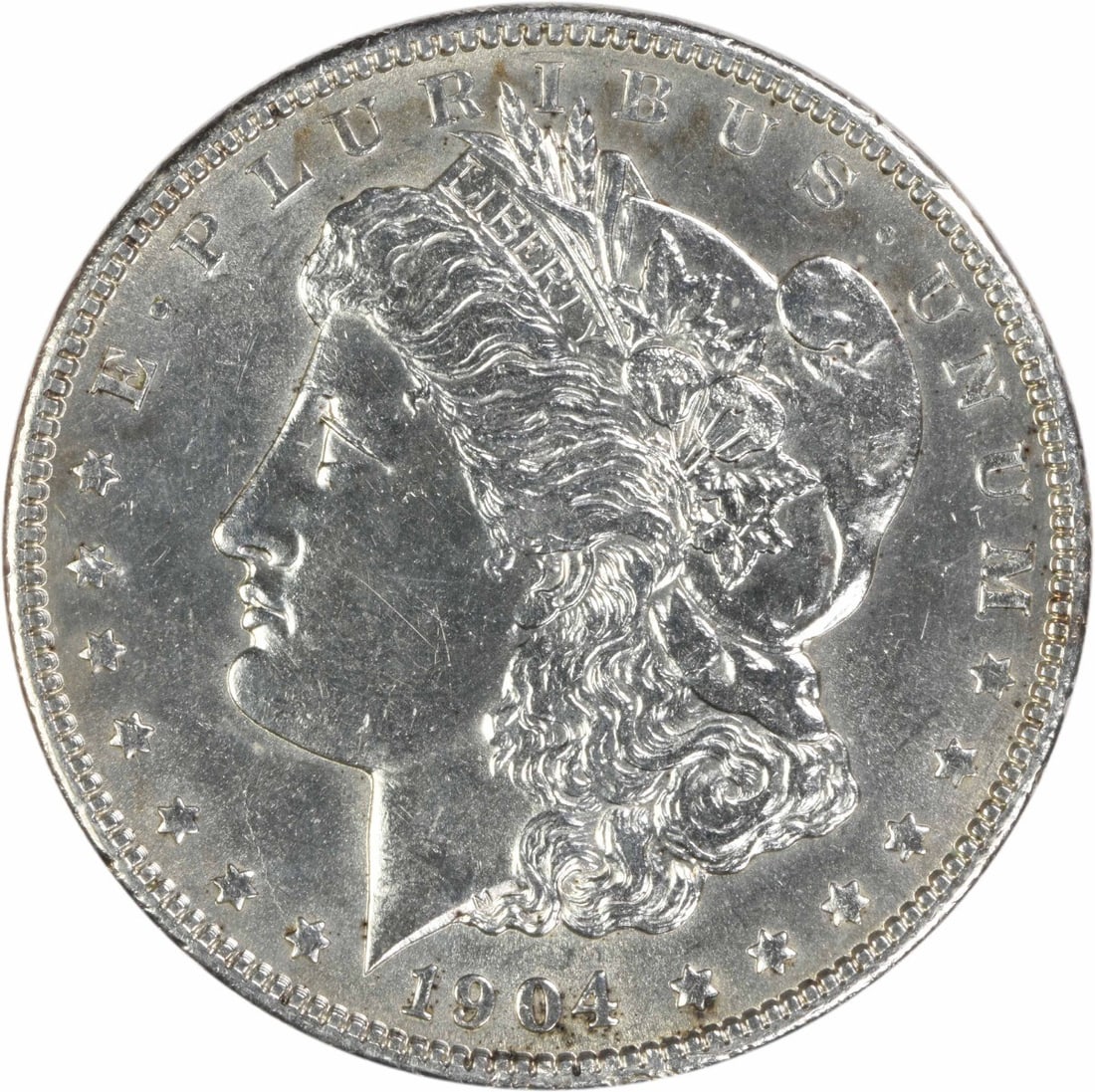 1904 Philadelphia Morgan Dollar 90 Silver Uncertified AU: 1904 Philadelphia Morgan Dollar 90 Silver Uncertified AU This 1904 Morgan Silver Dollar is an ungraded, circulated coin from the Philadelphia Mint, designed by George T. Morgan. Composed of 90% silver