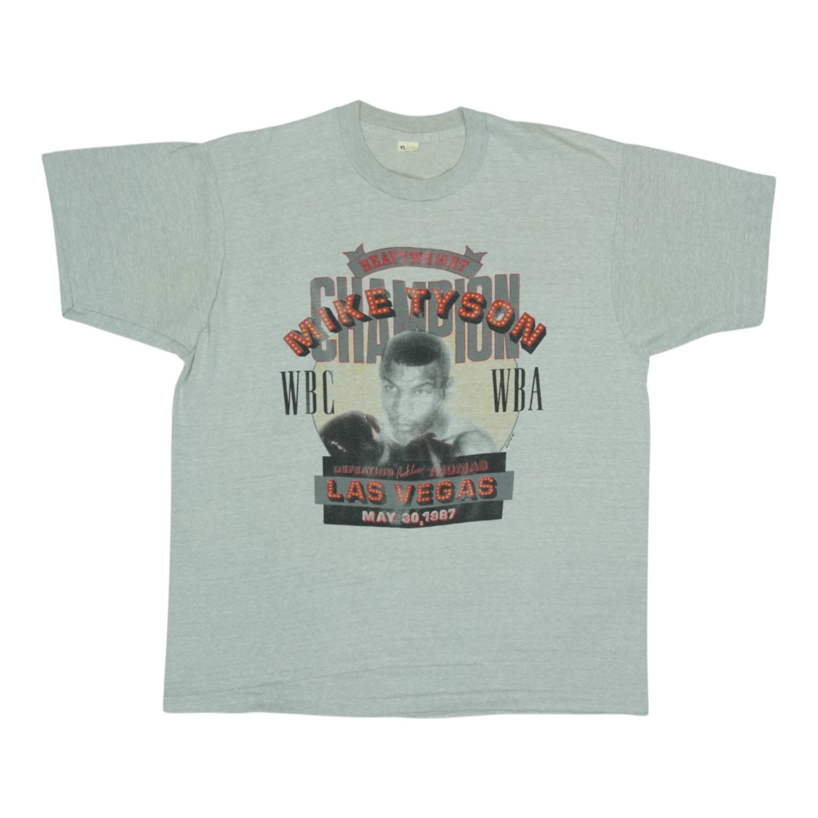 Vintage 1987 Mike Tyson Heavyweight Champion Grey Poly Cotton T-Shirt: Vintage 1987 Mike Tyson Heavyweight Champion Grey Poly Cotton T-Shirt This is an original vintage 1987 Mike Tyson Heavyweight Champion shirt, featuring no back graphics. The shirt is made from a 50/50