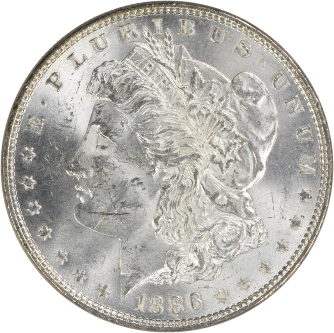 Brilliant Uncirculated 1886 Silver Morgan Dollar Uncertified No Mint Mark: Brilliant Uncirculated 1886 Silver Morgan Dollar Uncertified No Mint Mark This is an uncirculated 1886 Morgan Silver Dollar from the United States. The coin is composed of silver, has no mint mark, an
