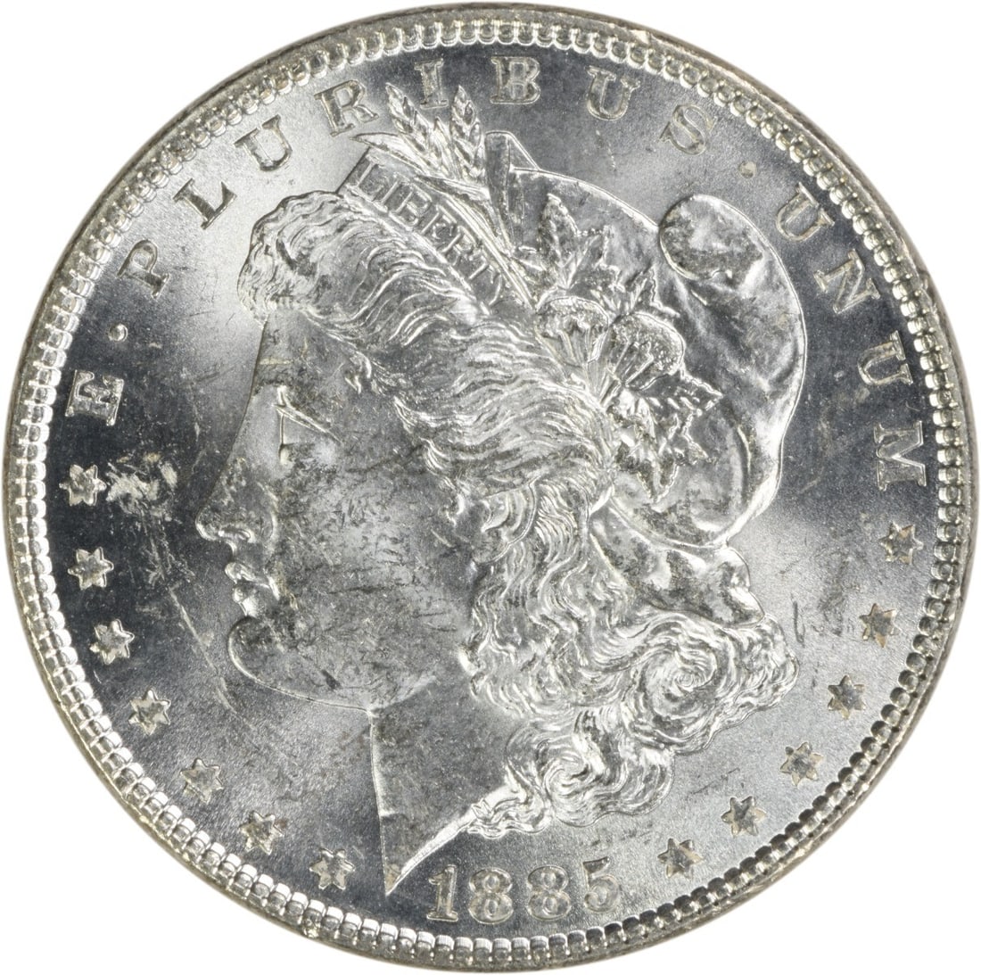 Uncirculated 1885 Silver Morgan Dollar Brilliant Uncertified No Mint Mark: Uncirculated 1885 Silver Morgan Dollar Brilliant Uncertified No Mint Mark This 1885 Morgan Silver Dollar is an uncirculated coin with brilliant uncirculated (BU) grade. It is composed of silver and wa