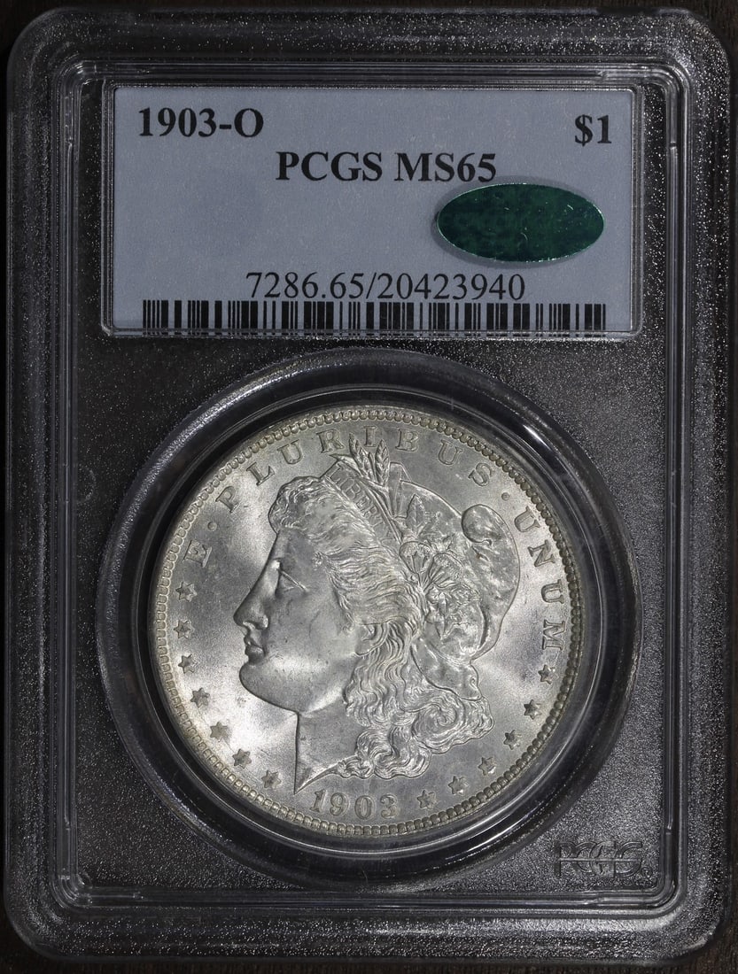 1903-O Morgan Dollar PCGS MS65 CAC Key Date Silver: 1903-O Morgan Dollar PCGS MS65 CAC Key Date Silver This is a 1903-O Morgan Silver Dollar graded MS65 by PCGS. The coin is uncirculated and features a high level of detail and luster. Struck in New Orl