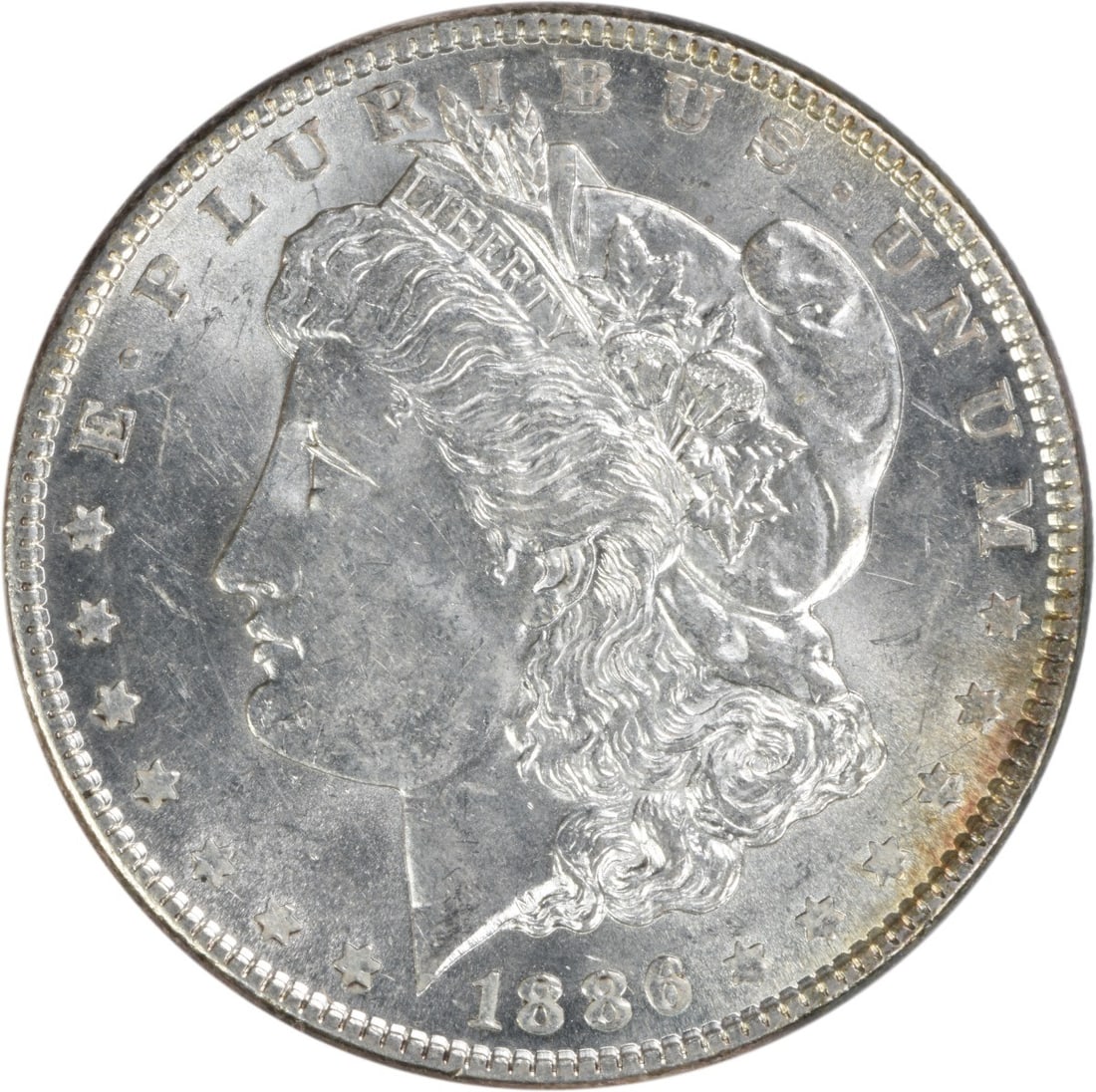 Uncirculated 1886 Morgan Silver Dollar Brilliant Uncertified US Coin: Uncirculated 1886 Morgan Silver Dollar Brilliant Uncertified US Coin This 1886 Morgan Silver Dollar is an uncirculated coin, featuring brilliant uncirculated (BU) grade. Composed of silver, it was min