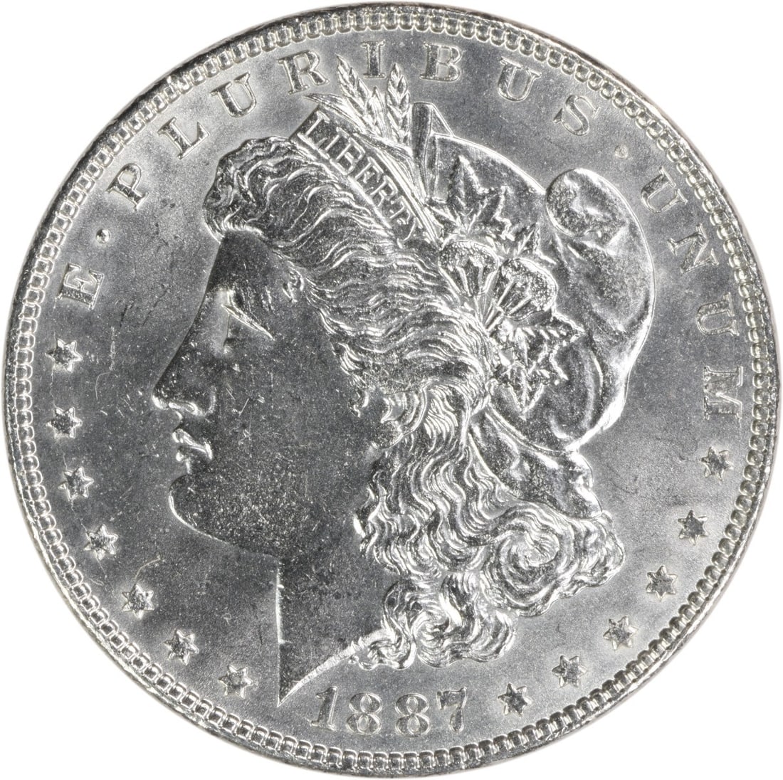 1887 Uncirculated Morgan Dollar Silver Coin No Mint Mark BU: 1887 Uncirculated Morgan Dollar Silver Coin No Mint Mark BU This 1887 Morgan Silver Dollar is an uncirculated example with brilliant uncirculated (BU) grade. Struck in silver, it features no mint mark