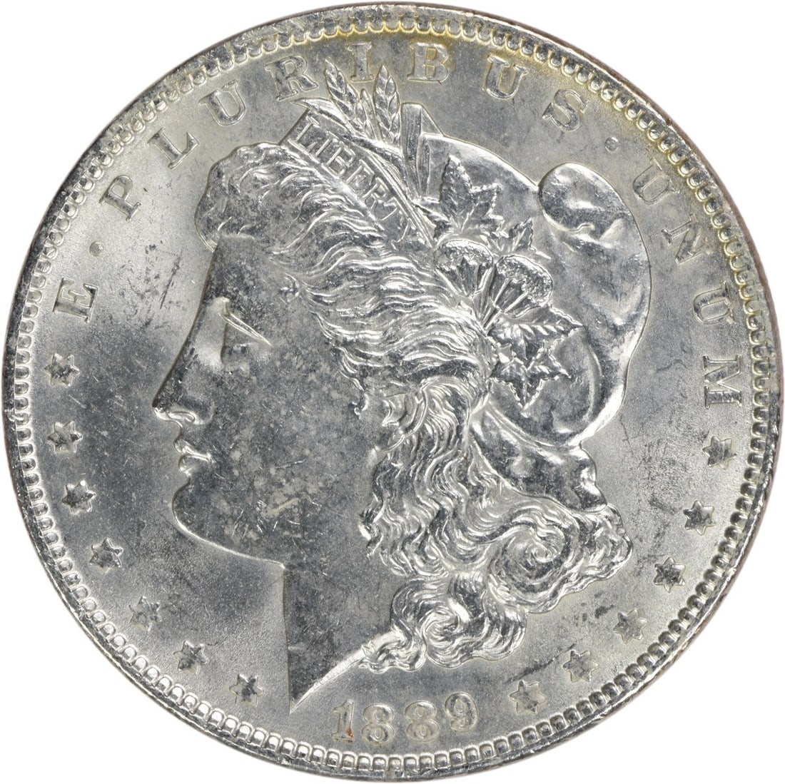 Brilliant Uncirculated 1889 Silver Morgan Dollar Uncertified No Mint Mark: Brilliant Uncirculated 1889 Silver Morgan Dollar Uncertified No Mint Mark This 1889 Morgan Silver Dollar is an uncirculated coin featuring a brilliant uncirculated (BU) grade. It is composed of silver