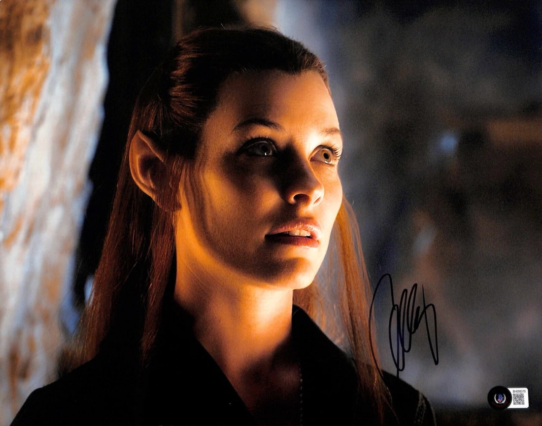 Evangeline Lilly Tauriel Autographed 11x14 Photo Beckett Certified: Evangeline Lilly Tauriel Autographed 11x14 Photo Beckett Certified This autographed 11x14 photograph features Evangeline Lilly as "Tauriel" from the movie The Hobbit. Signed in black permanent marker,