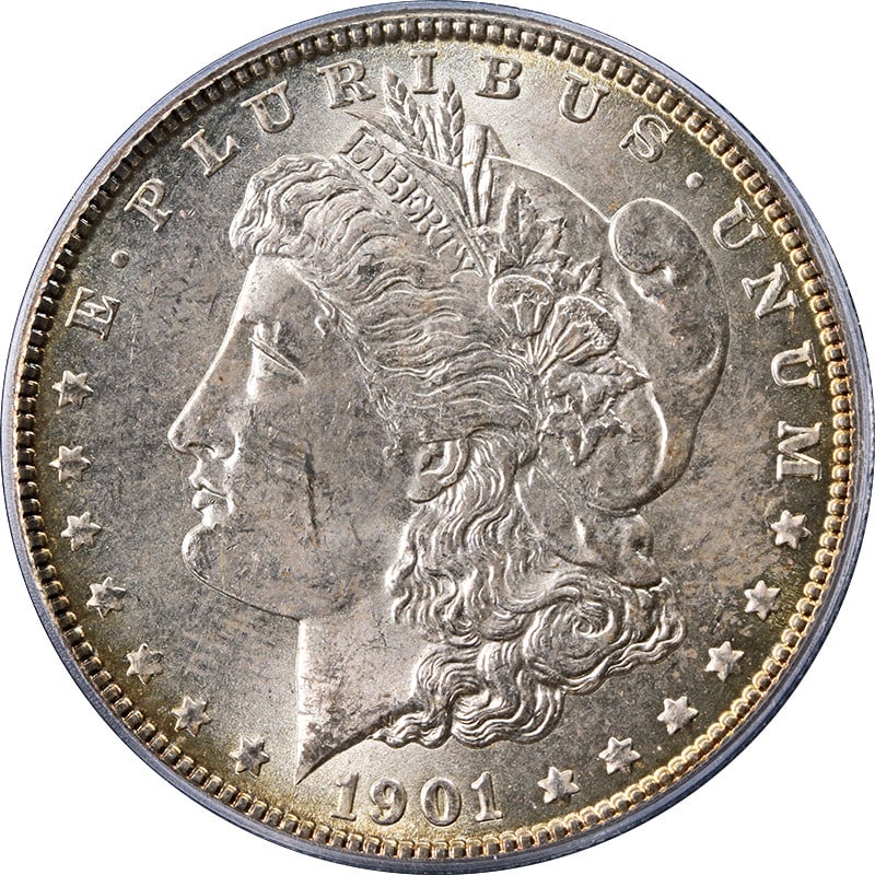 PCGS MS63 1901-O Silver Morgan Dollar with Toned Surfaces: PCGS MS63 1901-O Silver Morgan Dollar with Toned Surfaces This is a 1901-O Morgan Silver Dollar graded MS63 by PCGS. The coin is uncirculated and features natural toning. It was minted at the New Orle