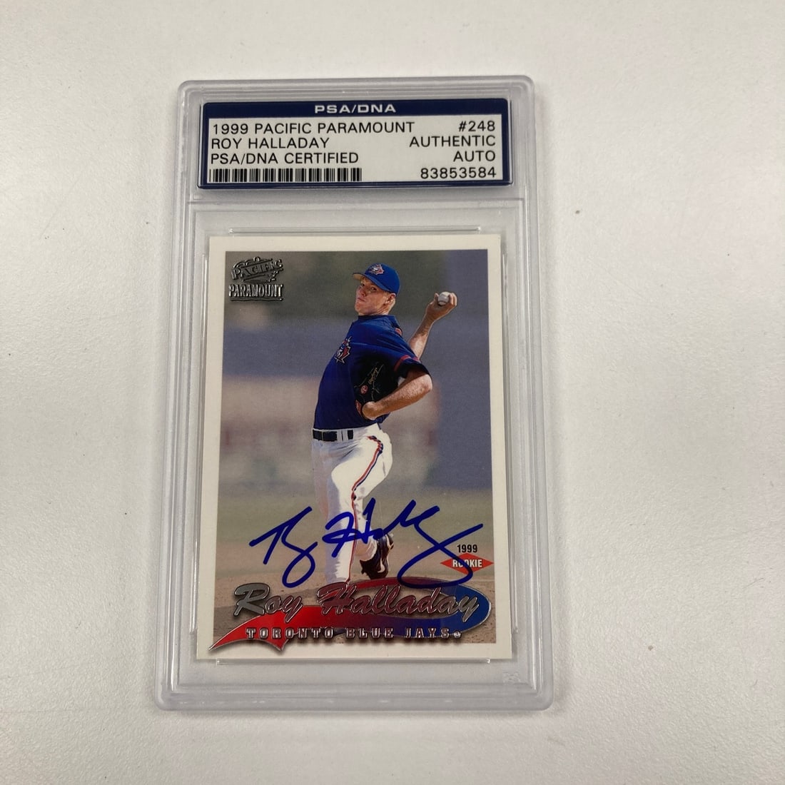 Roy Halladay 1999 Pacific Rookie Card PSA DNA Autograph: Roy Halladay 1999 Pacific Rookie Card PSA DNA Autograph This is a 1999 Pacific Roy Halladay rookie card featuring an authentic autograph. The card has been professionally authenticated by PSA/DNA, ens