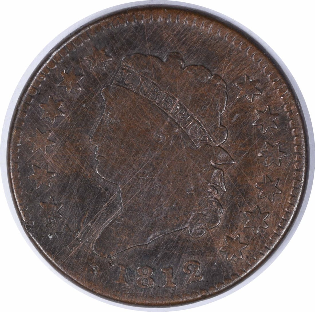 1812 Large Cent Classic Head Coin by John Reich VG Uncertified: 1812 Large Cent Classic Head Coin by John Reich VG Uncertified This 1812 Large Cent features the Classic Head design by John Reich, minted in Philadelphia. It is a pre-owned coin in Very Good (VG) con