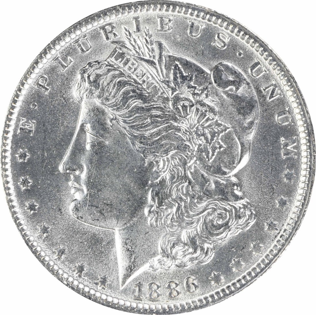 1886 Uncirculated Morgan $1 Silver Coin Uncertified MS63: 1886 Uncirculated Morgan $1 Silver Coin Uncertified MS63 1886 Morgan Silver Dollar in uncirculated, pre-owned condition. This silver $1 coin is listed as uncertified and graded MS63. Specifications Co
