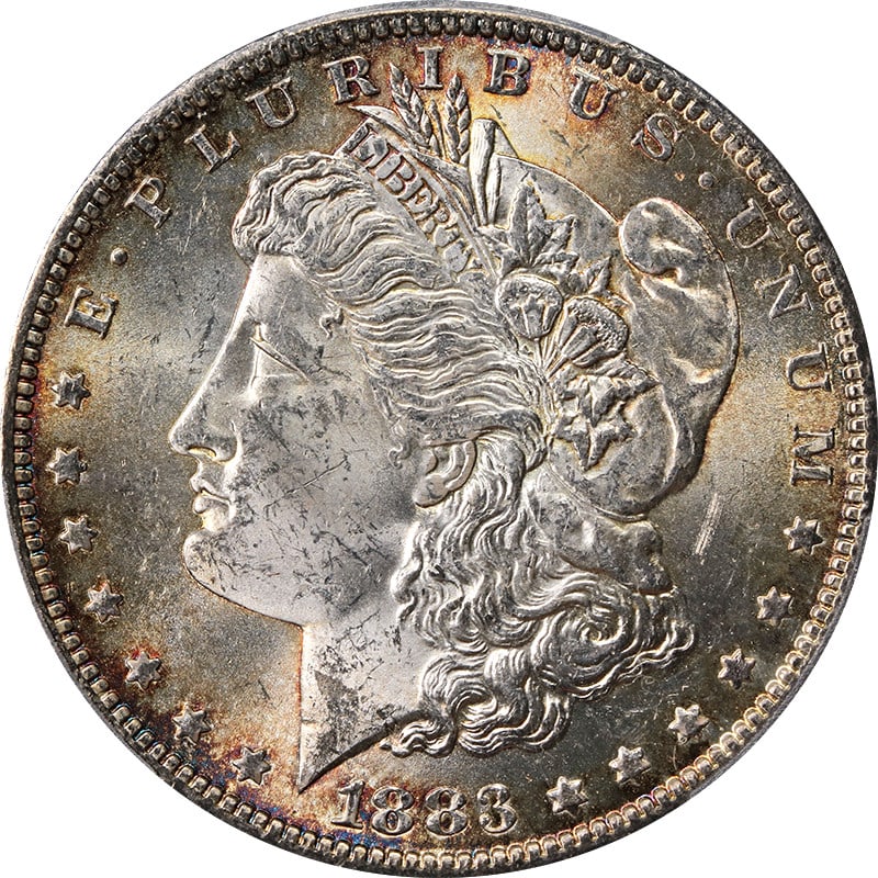 PCGS MS64 1883-O Morgan Dollar with Toned Silver Finish: PCGS MS64 1883-O Morgan Dollar with Toned Silver Finish This 1883-O Morgan Silver Dollar is certified by PCGS with a grade of MS64. The coin is uncirculated and features attractive toning. It was mint