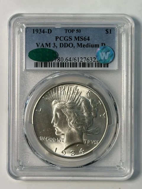 PCGS MS-64 CAC 1934-D Peace Dollar VAM 3 DDO Medium D: PCGS MS-64 CAC 1934-D Peace Dollar VAM 3 DDO Medium D Pre-owned 1934-D Peace Dollar graded MS-64 by PCGS and CAC. This silver dollar is identified as VAM 3 with DDO and Medium D, and is noted as Sight