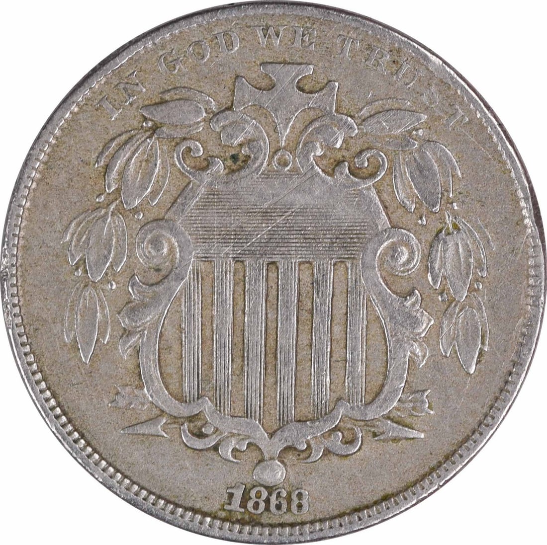 1868 United States Shield Nickel 5C EF Uncertified: 1868 United States Shield Nickel 5C EF Uncertified 1868 Shield Nickel 5C coin in EF grade. This circulated, uncertified United States coin is composed of nickel and is offered as a pre-owned piece. Sp