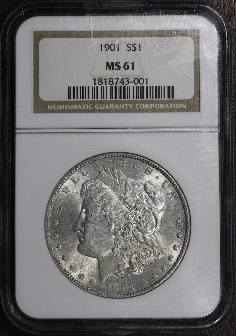 NGC MS61 1901 Morgan Silver Dollar $1 New Orleans: NGC MS61 1901 Morgan Silver Dollar $1 New Orleans 1901 Morgan Silver Dollar graded MS61 by NGC. This pre-owned United States $1 coin is struck in 0.9 fine silver and features the Morgan design. Specif