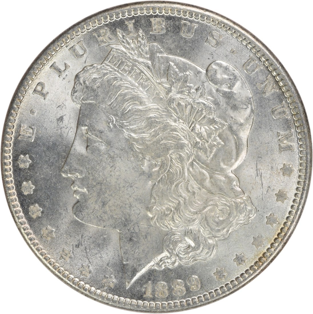 1889 Silver Morgan Dollar Brilliant Uncirculated Uncertified Coin: 1889 Silver Morgan Dollar Brilliant Uncirculated Uncertified Coin This 1889 Morgan Silver Dollar is an uncirculated coin from the United States. It features a brilliant uncirculated (BU) grade, compos