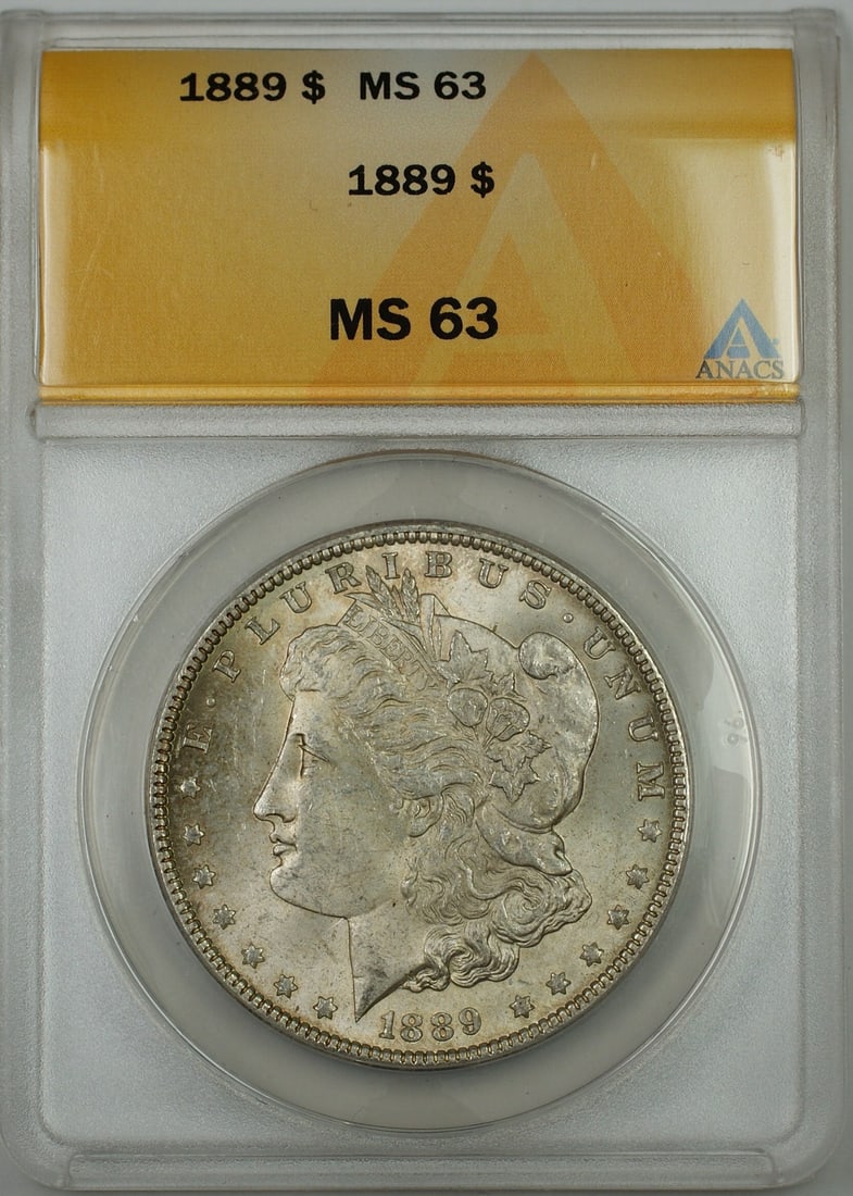 ANACS MS-63 1889 Morgan silver dollar lightly toned: ANACS MS-63 1889 Morgan silver dollar lightly toned This 1889 Morgan Silver Dollar is graded MS-63 by ANACS and features a lightly toned finish. Minted in Philadelphia, this uncirculated coin is compo