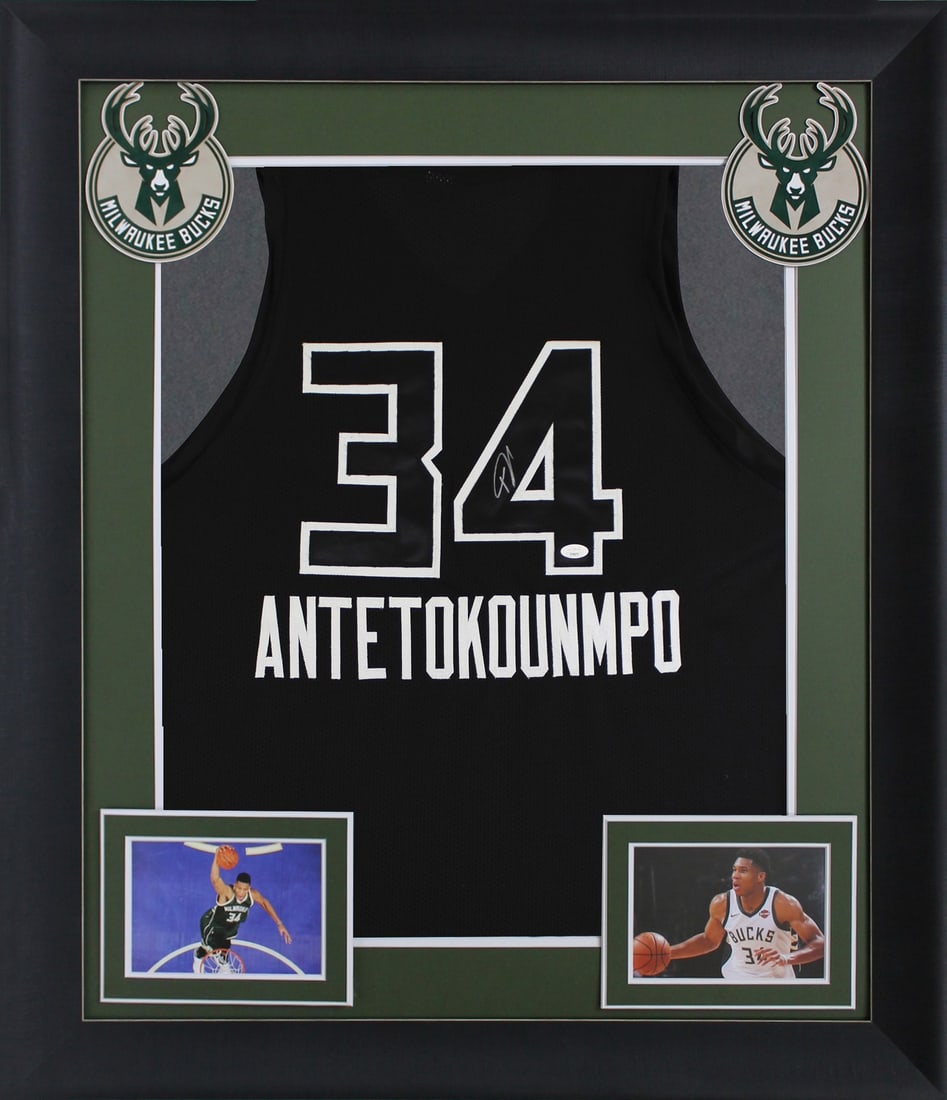 Framed Black Jersey Signed by Giannis Antetokounmpo with JSA COA: Framed Black Jersey Signed by Giannis Antetokounmpo with JSA COA This professionally framed black pro style jersey features black numbers and has been personally signed by Giannis Antetokounmpo of the