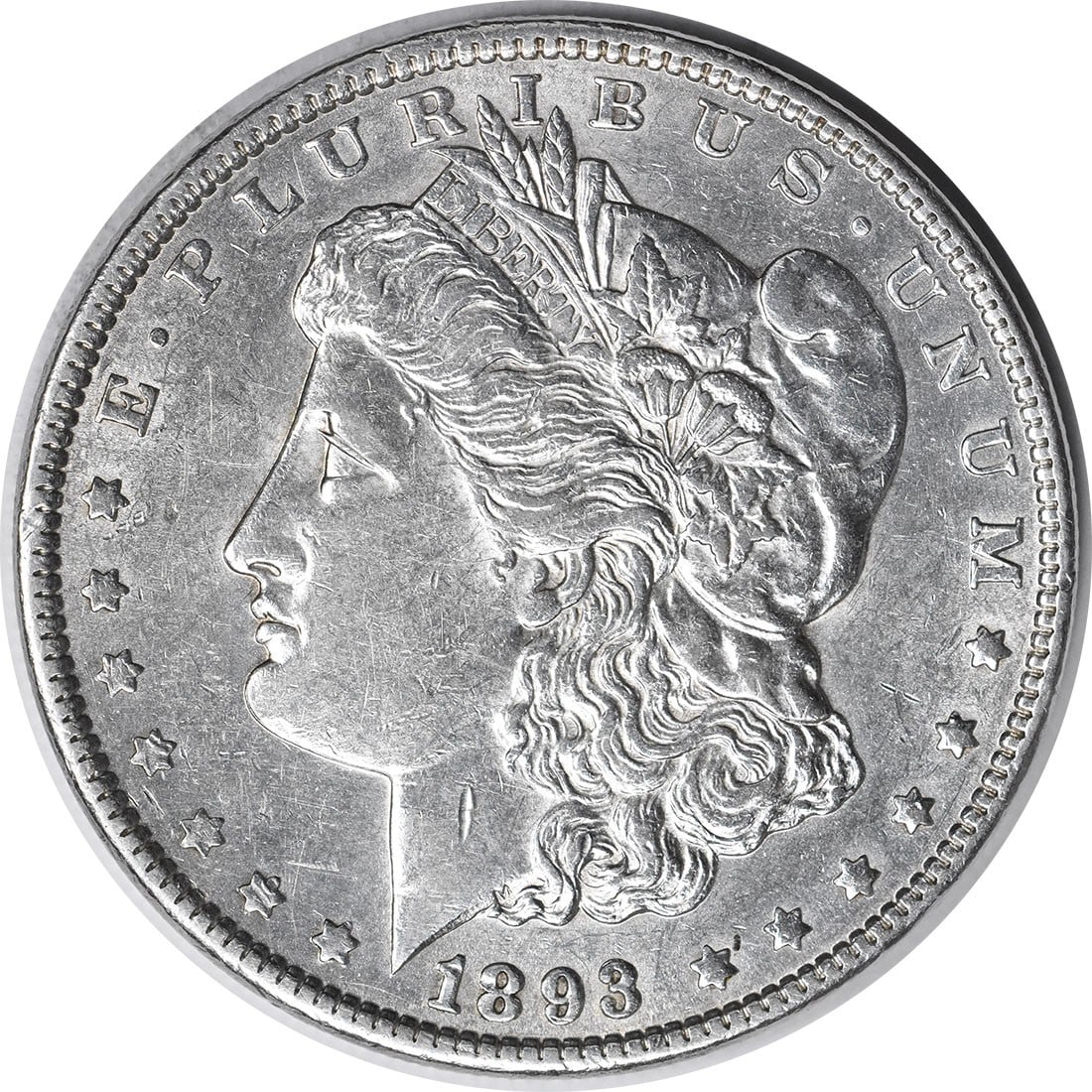 1893 Morgan Silver Dollar AU Uncertified 90% Silver Coin: 1893 Morgan Silver Dollar AU Uncertified 90% Silver Coin This 1893 Morgan Silver Dollar is a classic piece of American numismatics, featuring the iconic design by George T. Morgan. The coin is circula