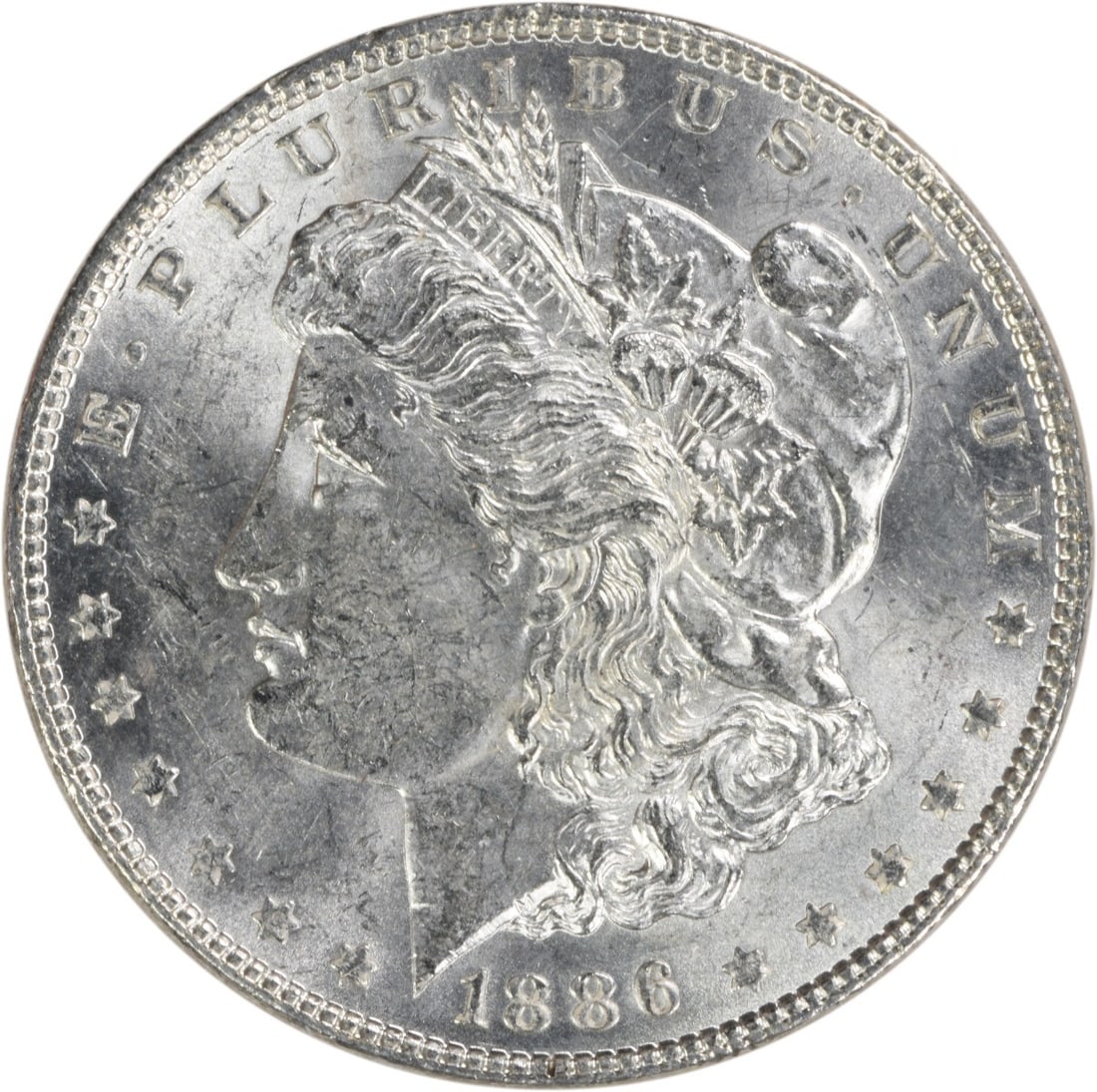 Uncertified 1886 Silver Morgan Dollar Brilliant Uncirculated No Mint Mark: Uncertified 1886 Silver Morgan Dollar Brilliant Uncirculated No Mint Mark This is an uncirculated 1886 Morgan Silver Dollar from the United States. The coin is composed of silver and features no mint 