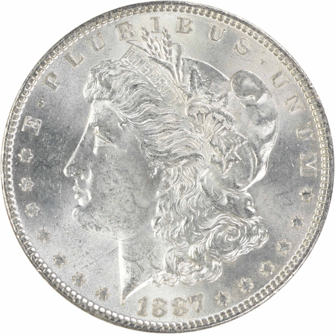 1887 Uncirculated Morgan Silver Dollar Philadelphia Mint Uncertified: 1887 Uncirculated Morgan Silver Dollar Philadelphia Mint Uncertified 1887 Morgan Silver Dollar in uncirculated, pre-owned condition. This uncertified coin features the classic Morgan design and is str