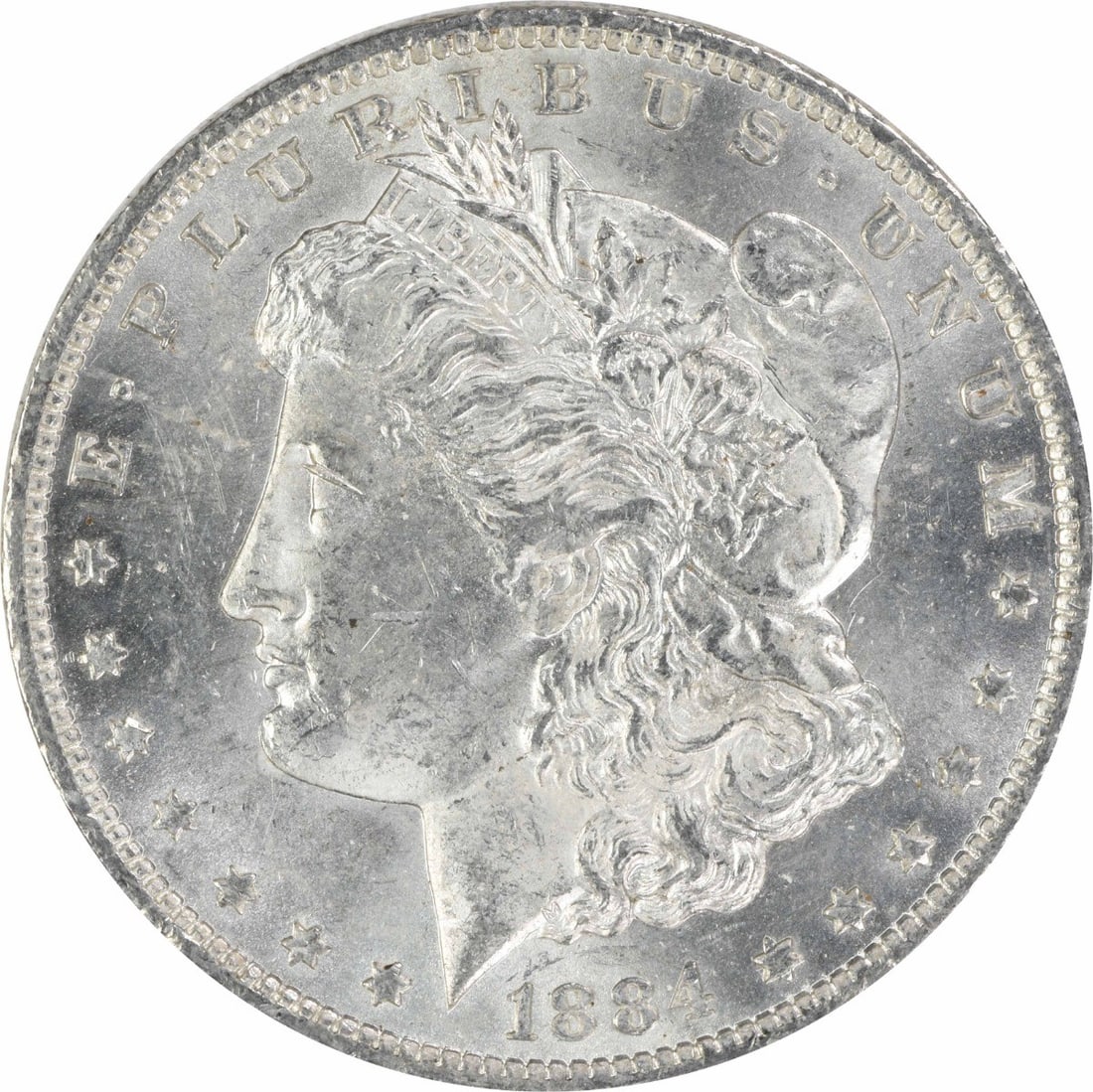 1884 O Morgan Silver Dollar $1 Uncirculated Silver Coin: 1884 O Morgan Silver Dollar $1 Uncirculated Silver Coin 1884-O Morgan Silver Dollar in uncirculated, pre-owned condition. This uncertified silver $1 coin is identified as KM 110 and graded MS60. Speci