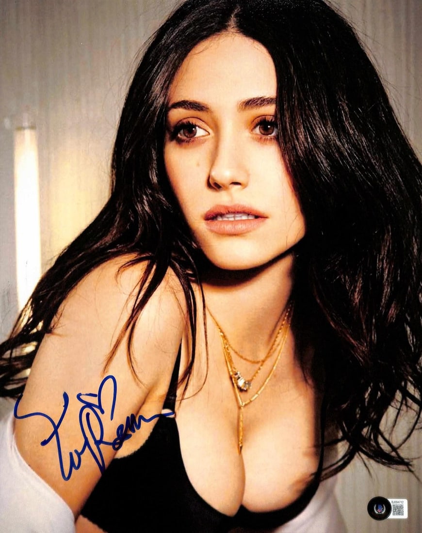11x14 Emmy Rossum autographed photo Beckett certified: 11x14 Emmy Rossum autographed photo Beckett certified This 11x14 color photograph features a bold blue ink autograph by actress Emmy Rossum, renowned for her role as Fiona Gallagher in the series Sham