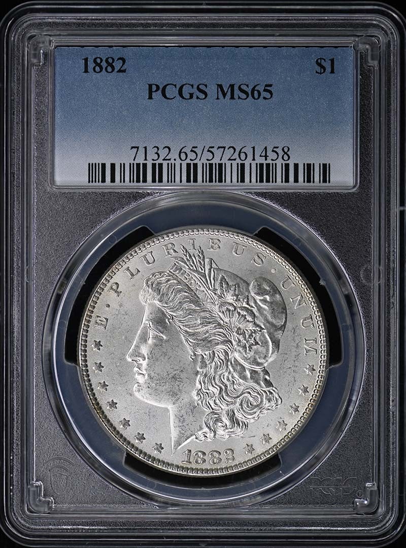 PCGS MS65 1882 Morgan Silver Dollar $1: PCGS MS65 1882 Morgan Silver Dollar $1 1882 Morgan Dollar certified by PCGS and graded MS65. This uncirculated United States silver dollar is a pre-owned coin from the Philadelphia Mint. Specification