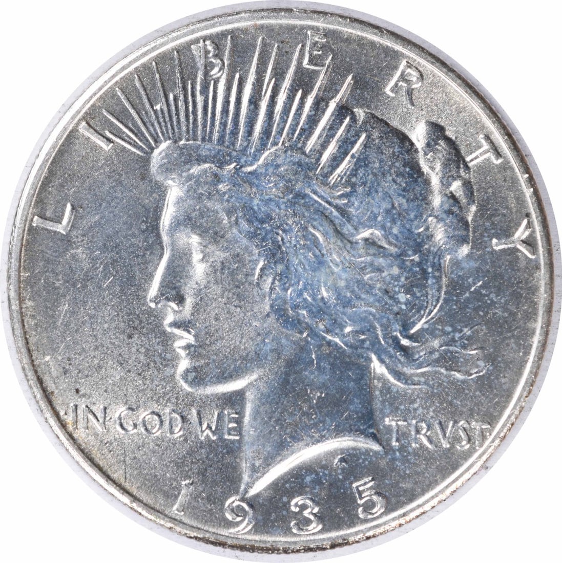 Uncirculated 1935 United States Peace Silver Dollar $1 Uncertified: Uncirculated 1935 United States Peace Silver Dollar $1 Uncertified 1935 Peace Silver Dollar in uncirculated, uncertified condition. This pre-owned $1 coin is composed of silver and listed with an MS60