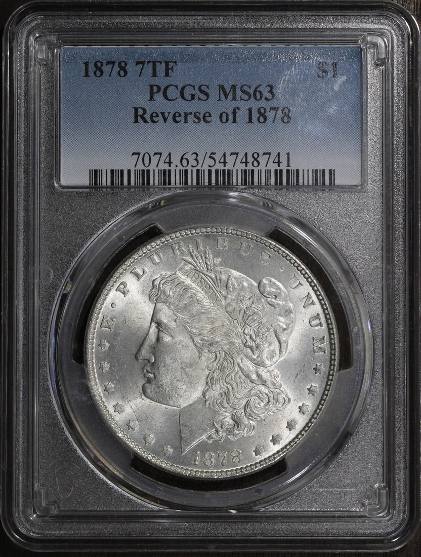 PCGS MS63 1878 Morgan Silver Dollar 7 Tailfeather $1: PCGS MS63 1878 Morgan Silver Dollar 7 Tailfeather $1 1878 Morgan Silver Dollar graded MS63 by PCGS. This pre-owned $1 coin is the 7 Tailfeather variety and is composed of silver. Specifications Denomi