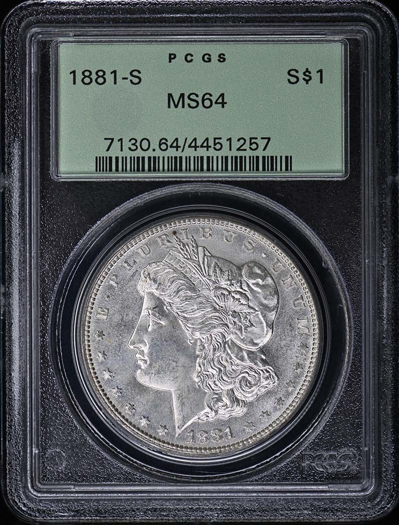 PCGS MS64 1881-S Morgan Silver Dollar OGH: PCGS MS64 1881-S Morgan Silver Dollar OGH 1881 Morgan Dollar certified by PCGS and graded MS64. This uncirculated coin is a pre-owned example of the Morgan Dollar series struck in the United States. S