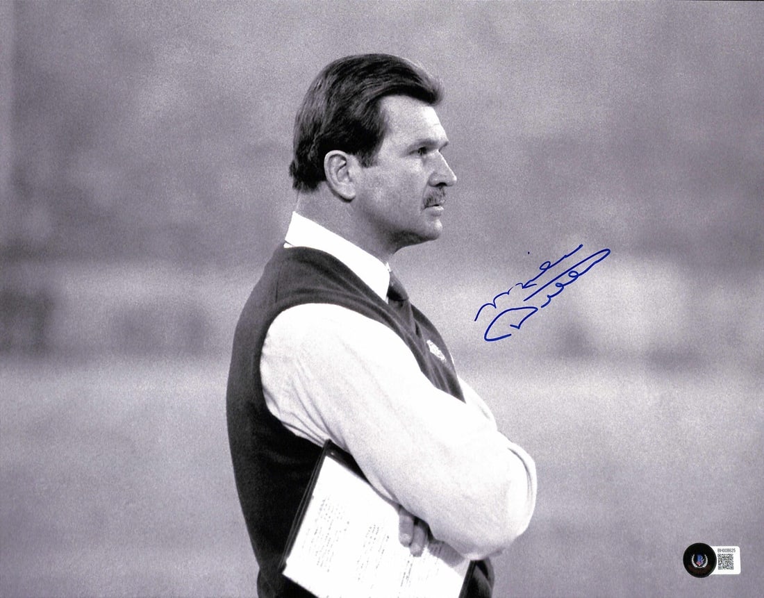 Mike Ditka Signed 11x14 Photo Beckett Certified Chicago Bears HOF: Mike Ditka Signed 11x14 Photo Beckett Certified Chicago Bears HOF This autographed 11x14 photograph features Mike Ditka, a Hall of Fame football player, who has signed it in blue permanent marker. The