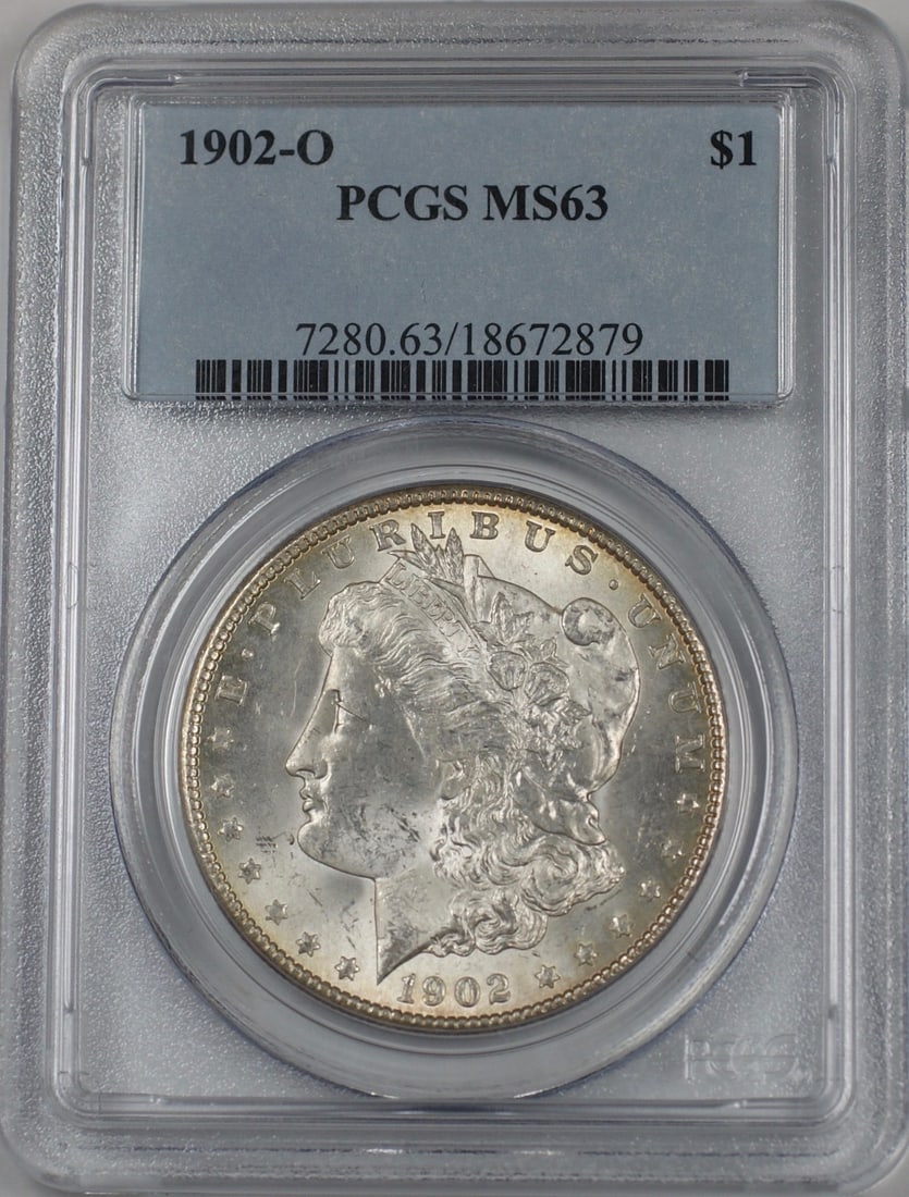 PCGS MS63 1902-O Silver Morgan Dollar Light Toning New Orleans Mint: PCGS MS63 1902-O Silver Morgan Dollar Light Toning New Orleans Mint This 1902-O Morgan Silver Dollar features a lightly toned surface and has been graded MS 63 by PCGS. Struck at the New Orleans Mint,