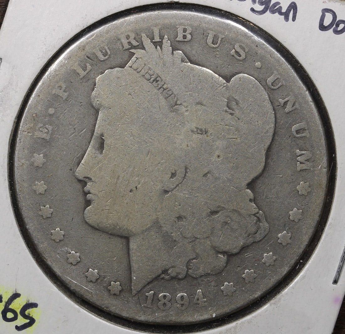 1894 Morgan Silver Dollar Philadelphia Mint AG Key Date: 1894 Morgan Silver Dollar Philadelphia Mint AG Key Date This is an 1894 Morgan Silver Dollar from the Philadelphia Mint, featuring a composition of 90% silver. The coin is circulated, ungraded, and un