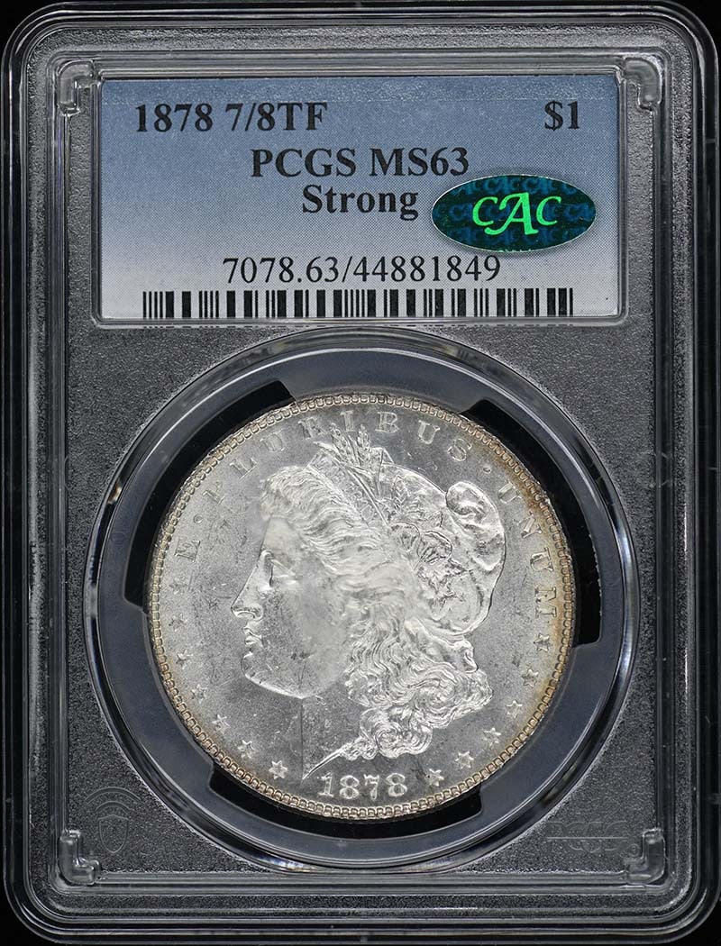 1878 Morgan Dollar PCGS MS63 CAC Uncirculated Philadelphia Mint: 1878 Morgan Dollar PCGS MS63 CAC Uncirculated Philadelphia Mint This 1878 Morgan Dollar is graded MS63 by PCGS and features a CAC designation, indicating its exceptional quality within the uncirculate