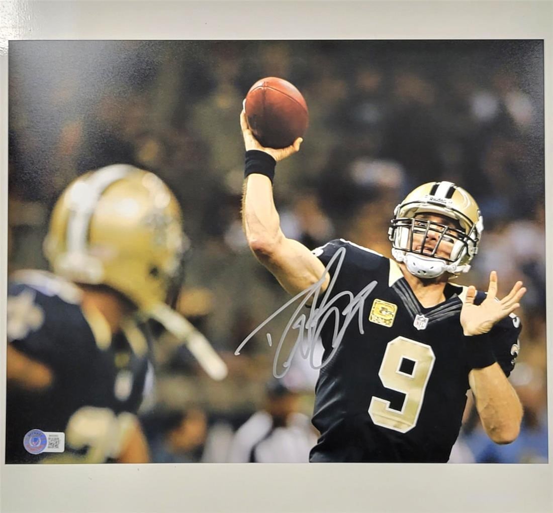 Drew Brees Signed 11x14 Photo New Orleans Saints Beckett BAS: Drew Brees Signed 11x14 Photo New Orleans Saints Beckett BAS This is an authentic 11x14 photograph of Drew Brees, signed by the legendary quarterback himself. The photo showcases Brees in action as a 