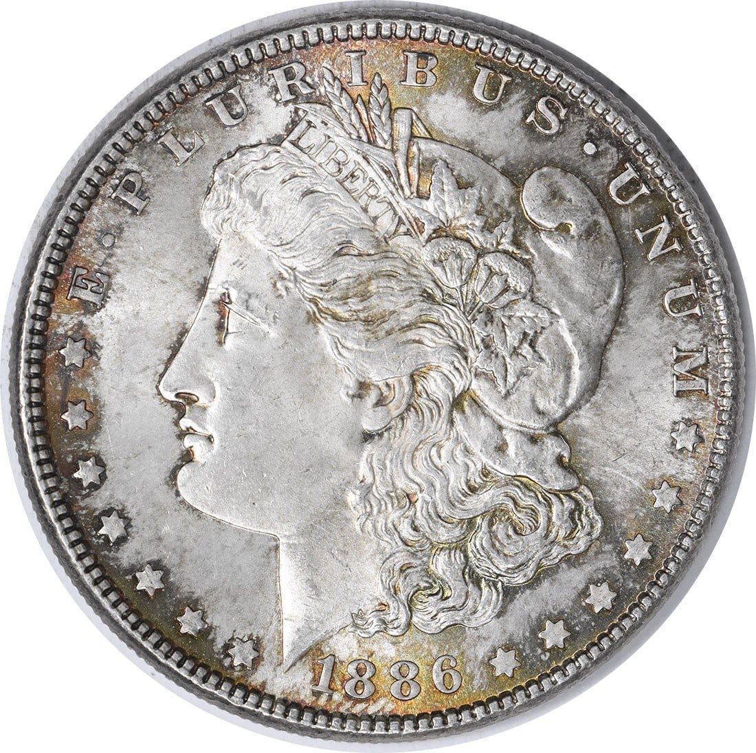 Choice BU 1886 Morgan Dollar Silver Coin With Toning Uncertified: Choice BU 1886 Morgan Dollar Silver Coin With Toning Uncertified This is an 1886 Morgan Silver Dollar featuring attractive toning. The coin is in Choice Brilliant Uncirculated (BU) condition and is un