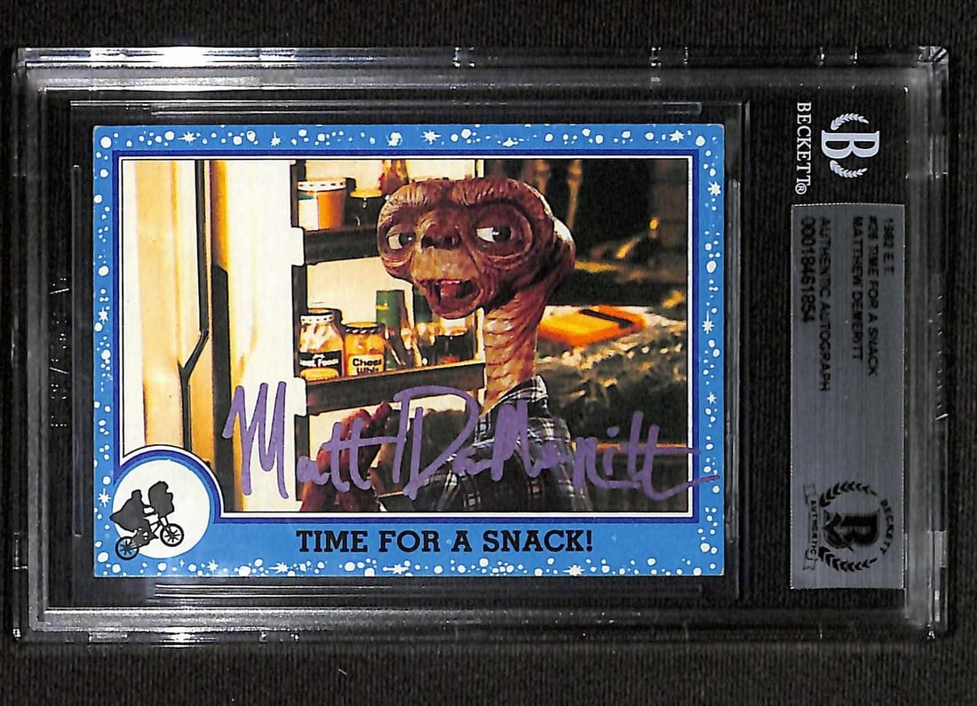 Beckett Authenticated Matthew Demeritt E.T. 1982 Topps Signed Card: Beckett Authenticated Matthew Demeritt E.T. 1982 Topps Signed Card This is a 1982 Topps #26 "Time for a Snack" non-sports card from the film E.T. the Extra-Terrestrial, hand-signed by Matthew Demeritt