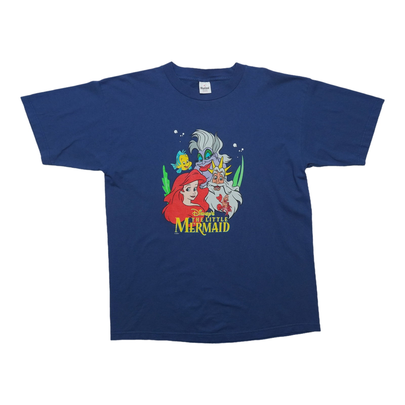 Vintage 1990s Disney Little Mermaid blue cotton tee: Vintage 1990s Disney Little Mermaid blue cotton tee This is an original vintage 1990s Disney The Little Mermaid shirt featuring a front graphic design. Made from 100% cotton, the shirt comes in blue a