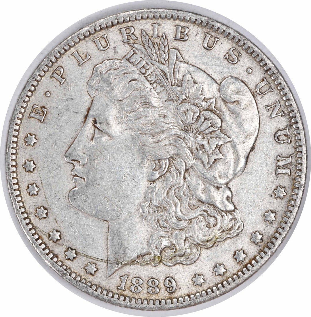 1889-O Morgan Silver Dollar AU Uncertified New Orleans Coin: 1889-O Morgan Silver Dollar AU Uncertified New Orleans Coin This 1889-O Morgan Silver Dollar is an exquisite addition for any coin collector. Struck in 90% silver and 10% copper, this coin showcases t