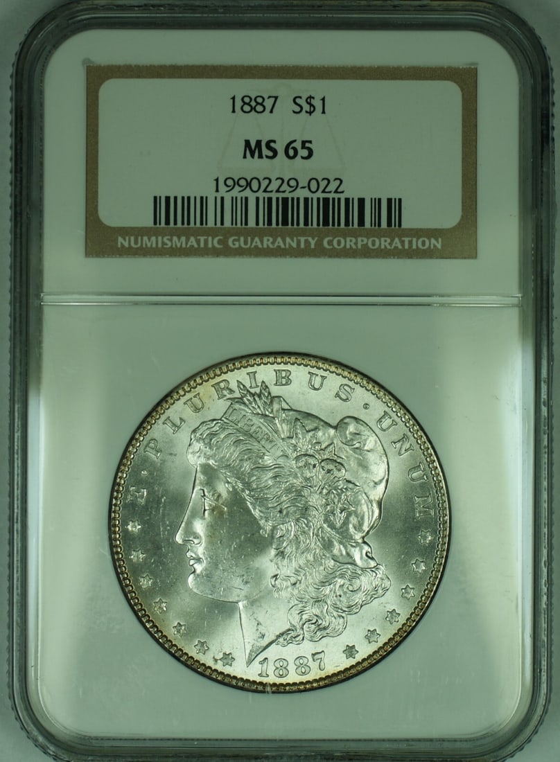 NGC Certified 1887 Morgan Dollar Silver $1 Coin MS 65 Uncirculated: NGC Certified 1887 Morgan Dollar Silver $1 Coin MS 65 Uncirculated This is an 1887 Morgan Silver Dollar $1 coin from the United States. The coin is uncirculated and has been graded MS 65 by NGC. It is