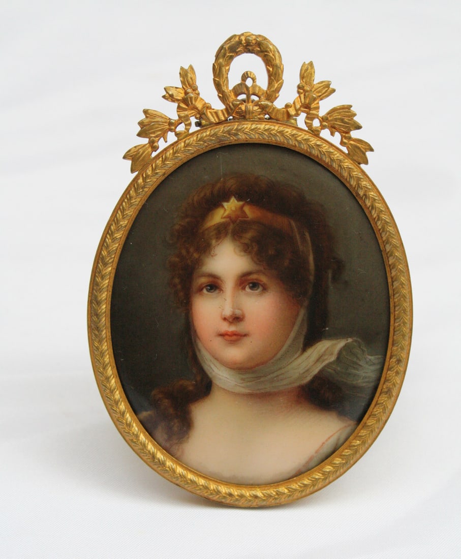 19C KPM Hand Painted Porcelain Portrait in Dore Bronze Frame: 19C KPM Hand Painted Porcelain Portrait in Dore Bronze Frame This exquisite 19th-century hand-painted porcelain piece showcases a charming portrait of a young girl. Crafted in Germany between 1850 and