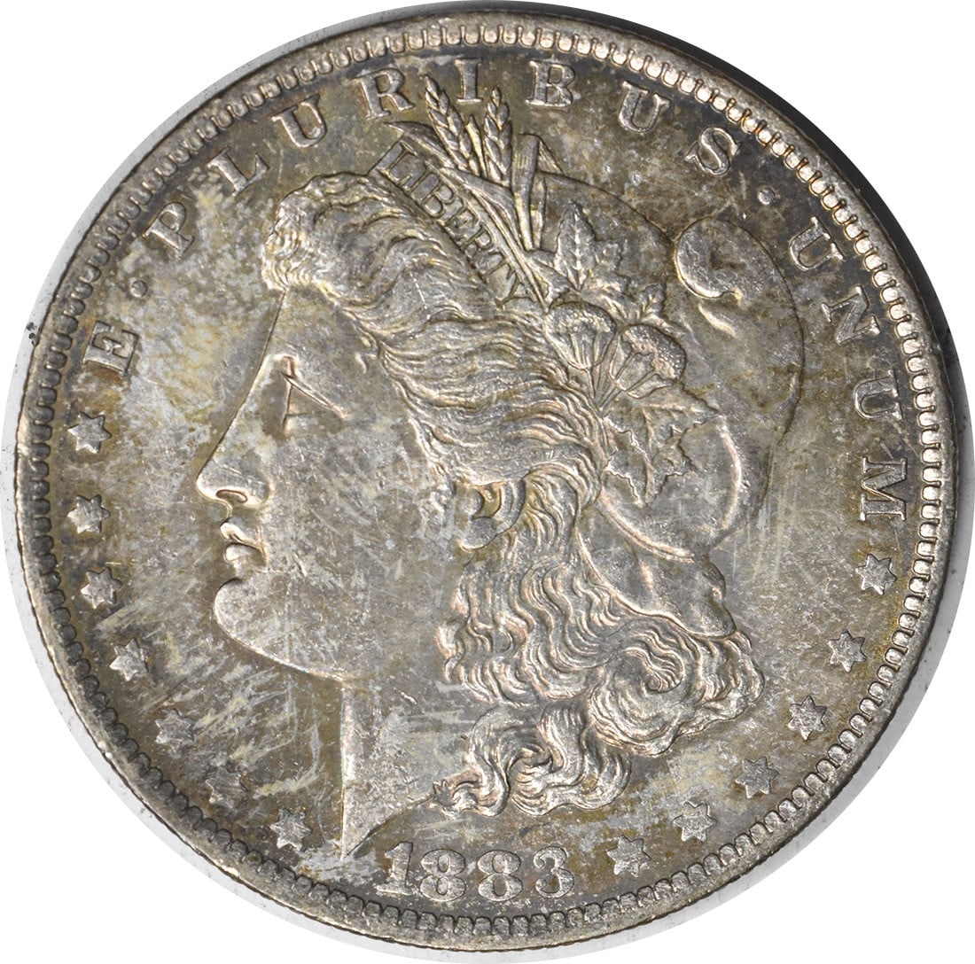 Uncirculated 1883-O Morgan Dollar Silver Coin Choice BU With Attractive Toning: Uncirculated 1883-O Morgan Dollar Silver Coin Choice BU With Attractive Toning This is an 1883-O Morgan Silver Dollar featuring attractive toning. The coin is in uncirculated condition and graded as C