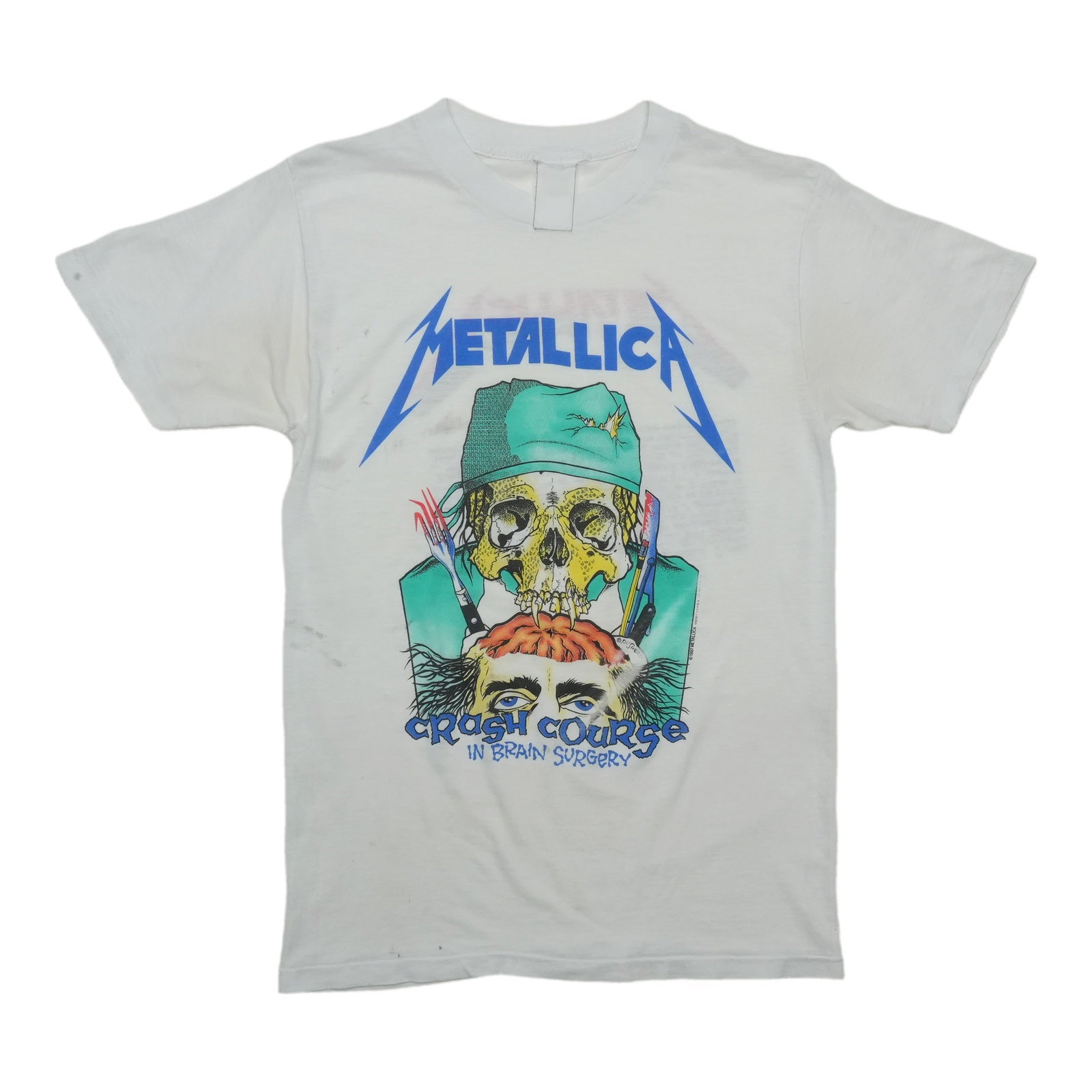 Vintage 1987 Metallica Brain Surgery White Tee: Vintage 1987 Metallica Brain Surgery White Tee This is an original vintage 1987 Metallica Crash Course in Brain Surgery shirt. It is a true vintage item from the 1980s, not a modern reproduction. The 