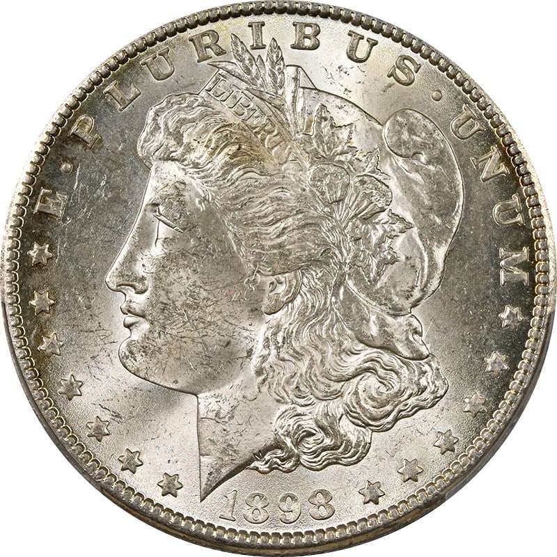 PCGS MS63 1898-O Silver Morgan Dollar with Subtle Toning: PCGS MS63 1898-O Silver Morgan Dollar with Subtle Toning This 1898-O Morgan Silver Dollar is graded MS63 by PCGS and features light toning. Struck at the New Orleans Mint, this uncirculated coin is co