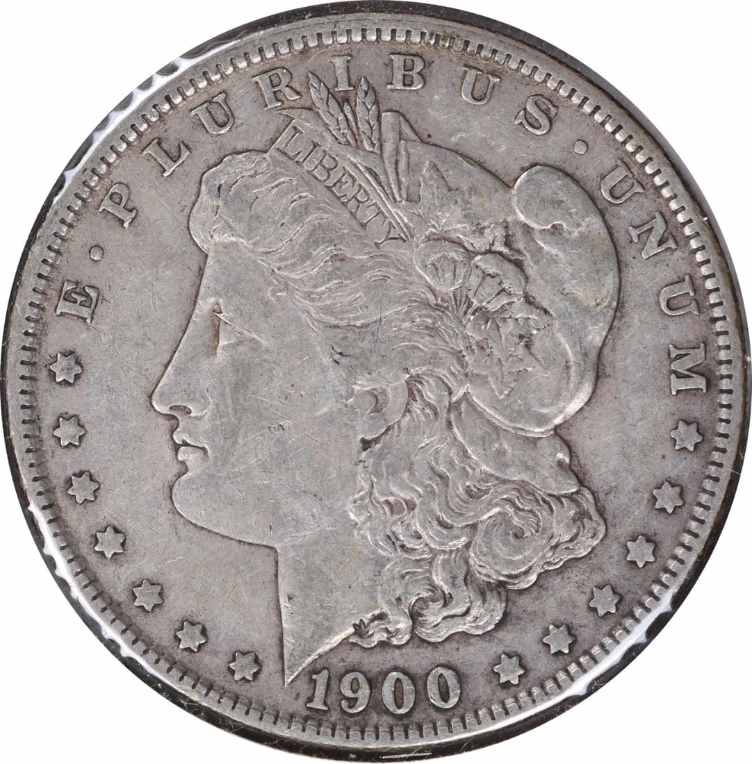 1900-O Morgan Silver Dollar 90% Silver Uncertified Coin: 1900-O Morgan Silver Dollar 90% Silver Uncertified Coin This 1900-O/CC Morgan Silver Dollar showcases a rich history with a striking design by George T. Morgan. Featuring a composition of 90% silver a