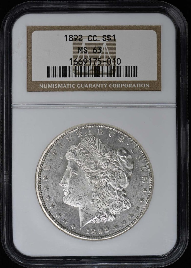 NGC MS63 Carson City 1892 Morgan Silver Dollar: NGC MS63 Carson City 1892 Morgan Silver Dollar This 1892-CC Morgan Dollar is graded MS63 by NGC and is uncirculated. Minted in Carson City, this coin is a fine example from the United States and remai